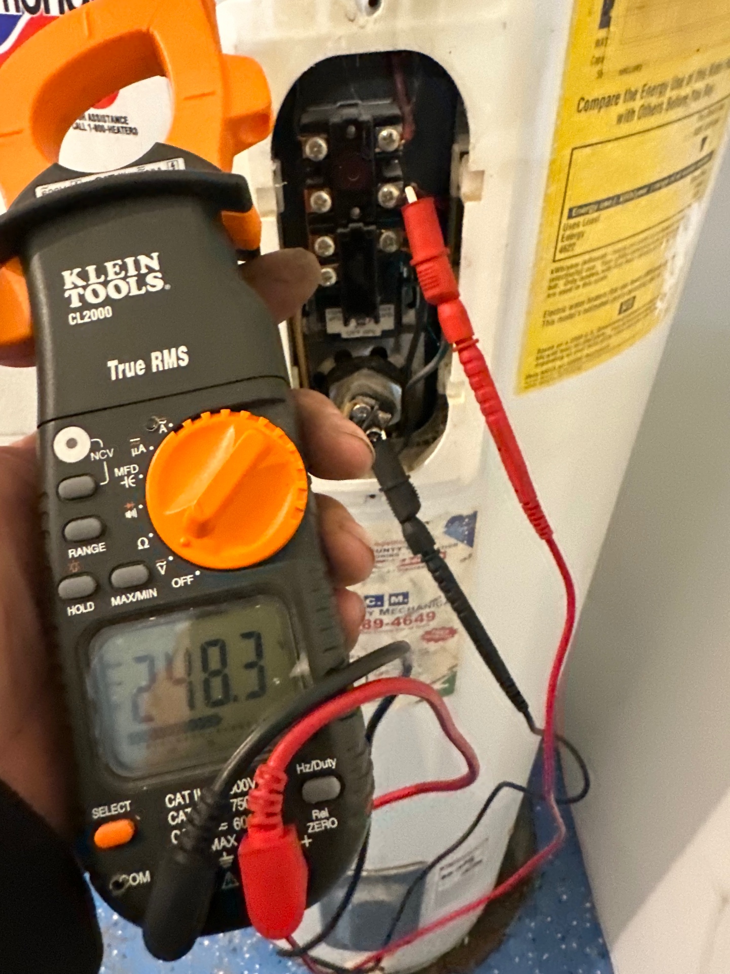 Live 240V diagnostics on a failed water heater element — metered, verified, repaired.